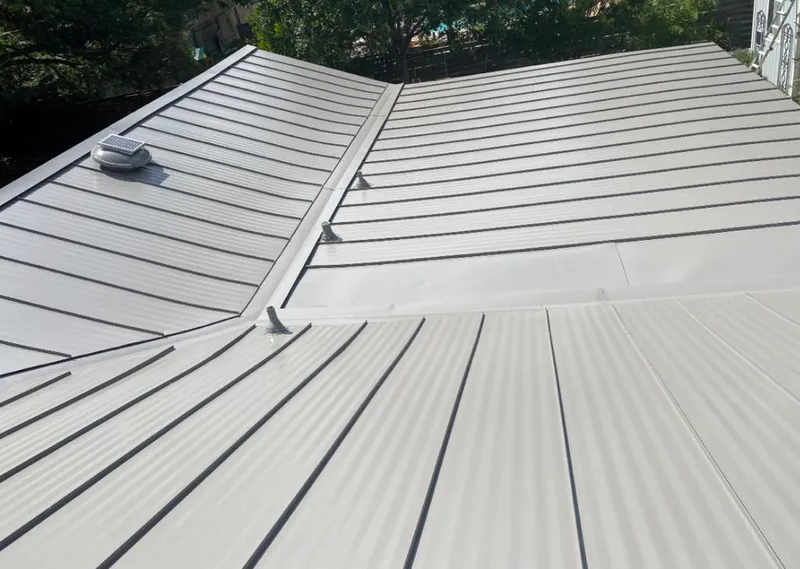 Solar attic fan installed on a metal roof for Roof Ventilation in Rotonda